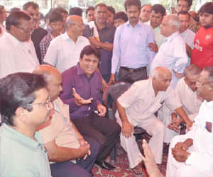 Attack on businessman, block road.