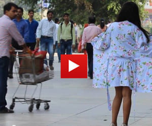 must watch- a girl removes her gown on the crowded road
