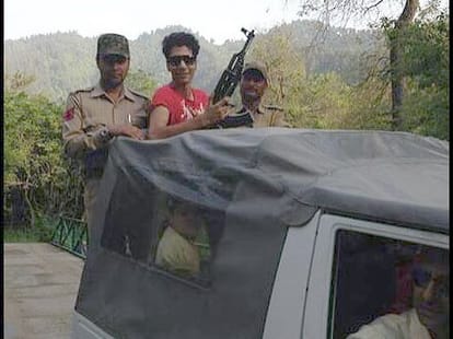 With AK-47 at the picture of the son of NC leader furore