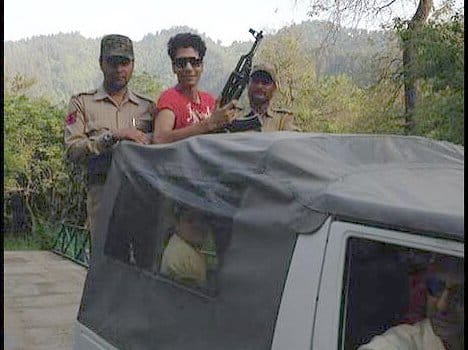 With AK-47 at the picture of the son of NC leader furore