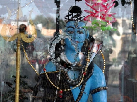 row over fire on lord shiva idol in jammu