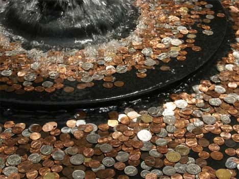 why people throw coin in water