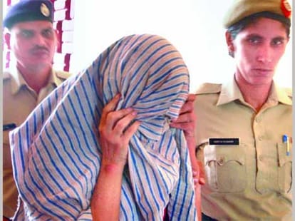 Drunken woman is commotion in the police station.