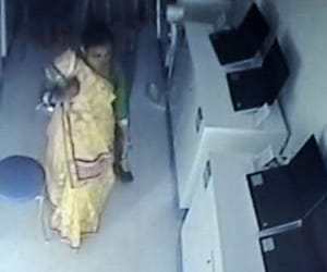 woman thefts laptop in her undergarments