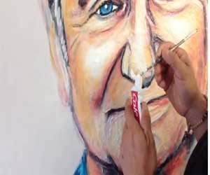 man who paints via toothpaste
