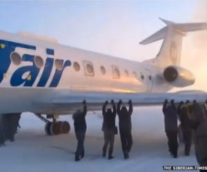 siberia passengers push plane, minus 50 degrees in siberia.