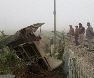 Tractor hit by train, two killed.