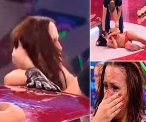 bikini clad woman got  a punch in tv game show