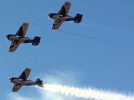 chained aeroplanes performs breathtaking stunts