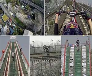 man rides motorcycle on roller coaster
