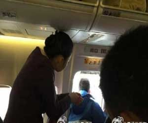 man popped his head out of emergency exit of planes