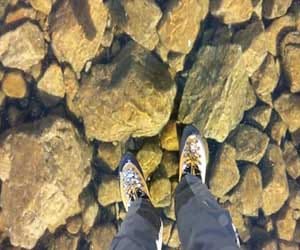 hiker walk on stunning frozen lake