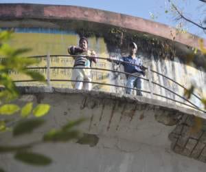 disabled climb on water tank.