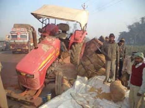 Uncontrolled auto , tractor overturned