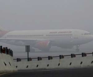 flight delayed because pilot not trained to land in heavy fog