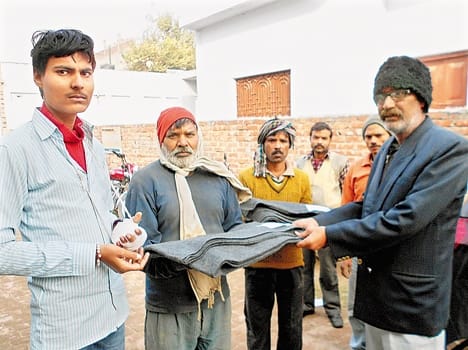 distributed blankets to the poor on Principal death anniversary