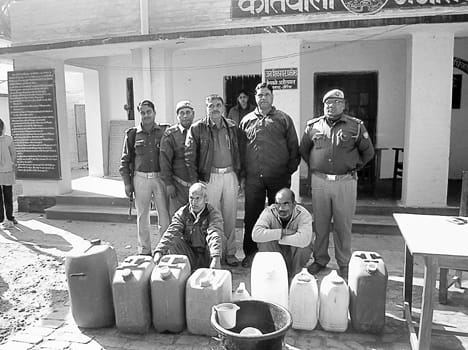Police arrested two including illicit liquor