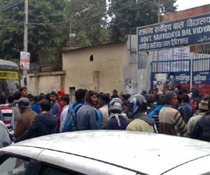protest of the candidates in the examination of postman.
