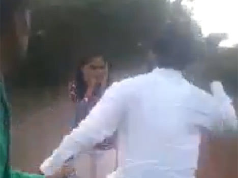 gang of boys beats a girl and boy on road