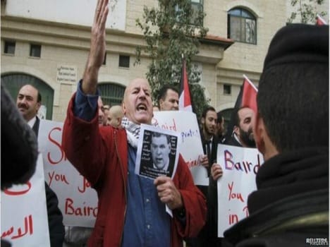 people protest against canada foreign minister