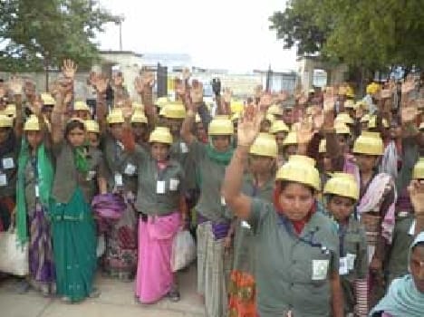 Performed by workers for wages