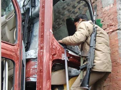 police raid on looted vehicles godown.