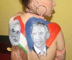 heroine topless and make tattoo on Obama-Modi