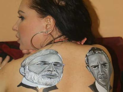 heroine topless and make tattoo on Obama-Modi
