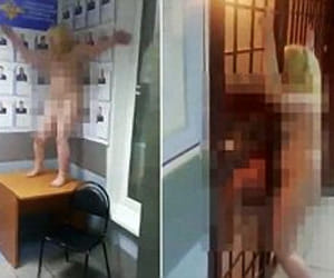 woman stripped naked and started dancing in police station
