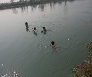 two students swayed in canal