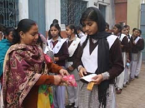 teacher cheque students in board examination