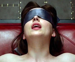 women fight while watching Fifty Shades of Grey