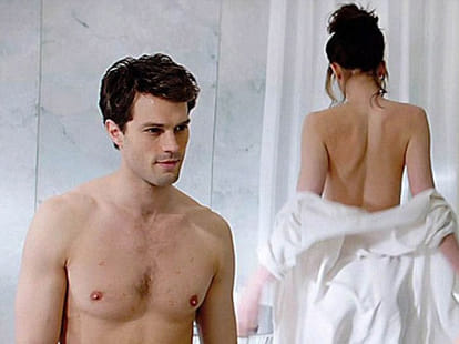 women fight while watching Fifty Shades of Grey