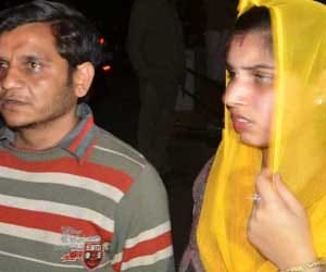 pregnent woman and husband beaten in police station.