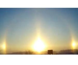 triple sunrise in russian city.