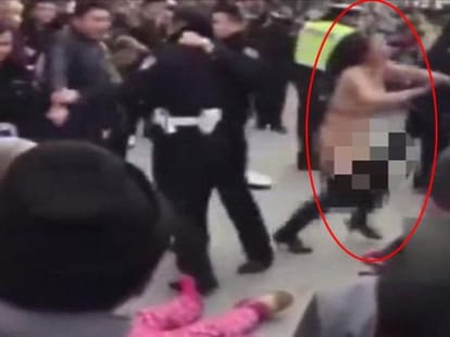 Woman strips naked to save husband from police
