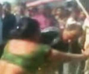 policeman beat woman.