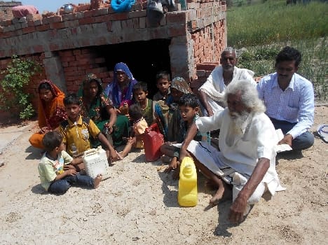 Family sitting on the lay with kerosene