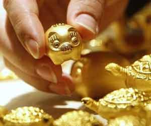 gold prices fall, silver gain