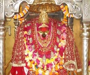 Head bowed at the feet of mother