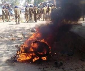 bloody confrontation in 2 villages in haryana , fiercely pelt stones