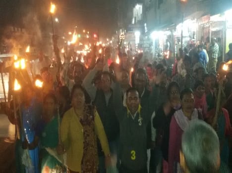 Forest villagers pulled torch procession in the city