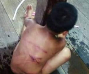 woman punished boy as he stole candy