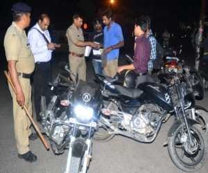 police checking on black pulsar in roorkee.
