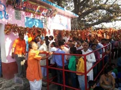 People immersed in devotion to the temple of the house of power