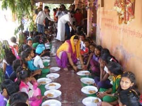 girls offer food by devotee