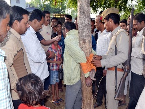 Accused of theft Tied to a tree and beaten
