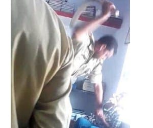 police man beaten boy with belt