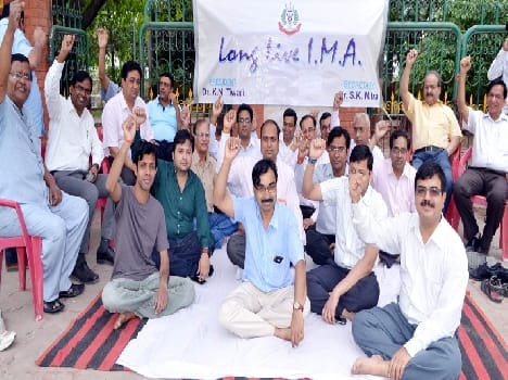 Doctors encompass black blindfold