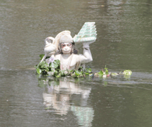 Statue of lord Hanuman in flowing stream of Gomati.